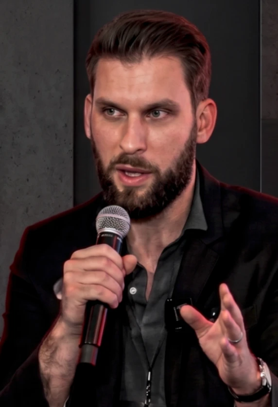 Drew Long speaking on stage