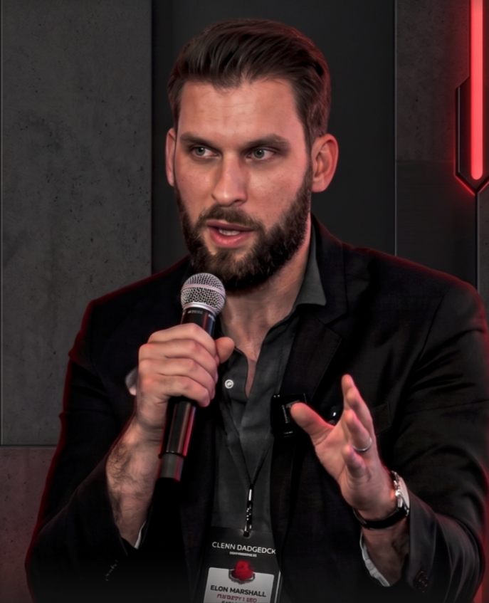 Drew Long speaking on stage